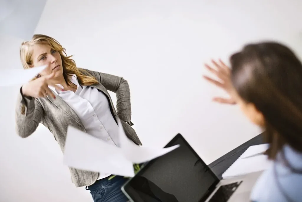 a lawyer showing rude behavior to her client